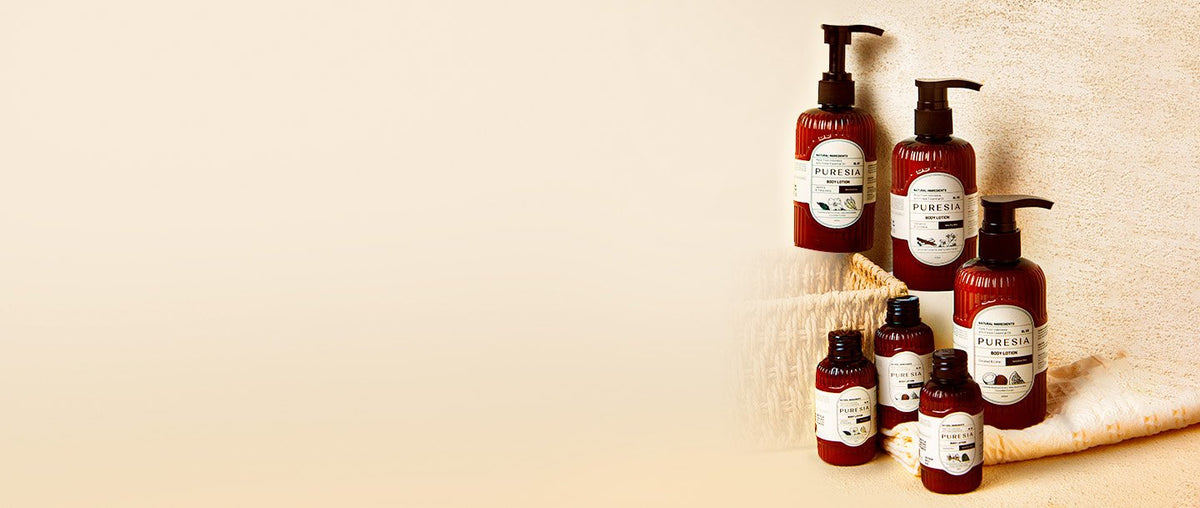 The PURESIA body lotion range on a linen towel