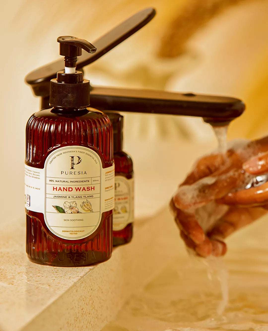 PURESIA hand wash in recycled packaging on a bathroom counter